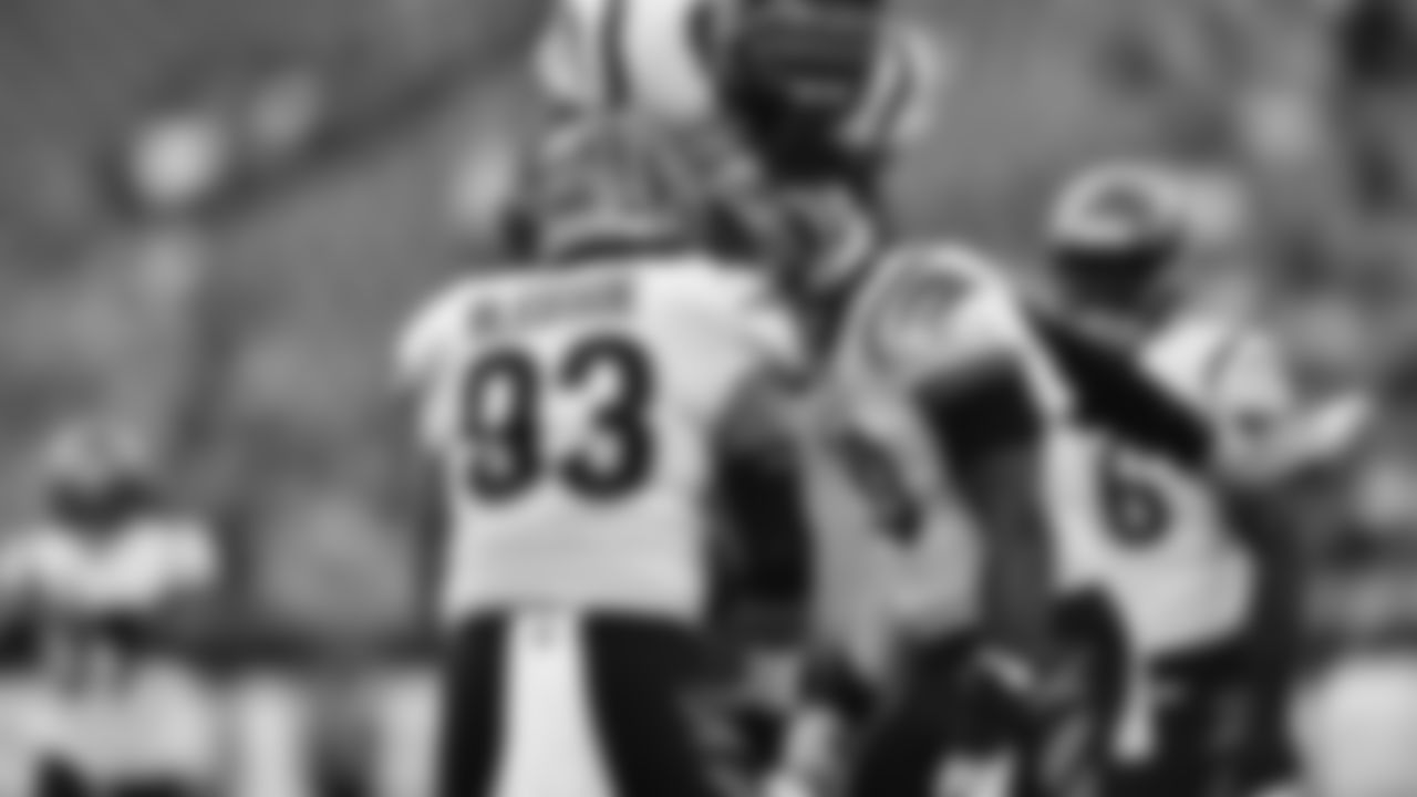 The Bengals defense celebrates a sack by defensive end Khalid Kareem against the Miami Dolphins in preseason action.