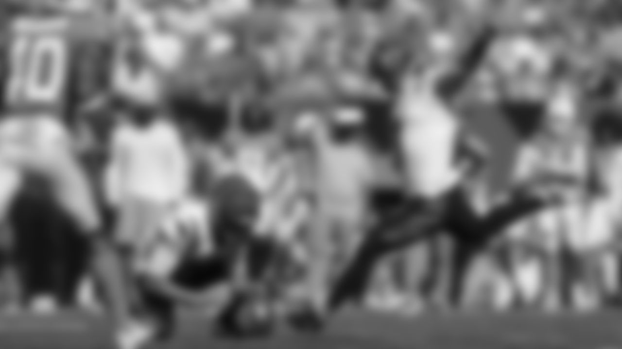 Cincinnati Bengals kicker Austin Seibert (3) kicks an extra point from the hold of Kevin Huber in the first half of an NFL exhibition football game against the Miami Dolphins in Cincinnati, Sunday, Aug. 29, 2021. (AP Photo/Aaron Doster)