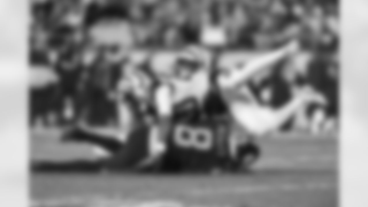 CB Eli Apple and DE Sam Hubbard tackle Steelers QB Kenny Pickett during the second quarter of the Bengals-Steelers game in Week 11 of the 2022 season.