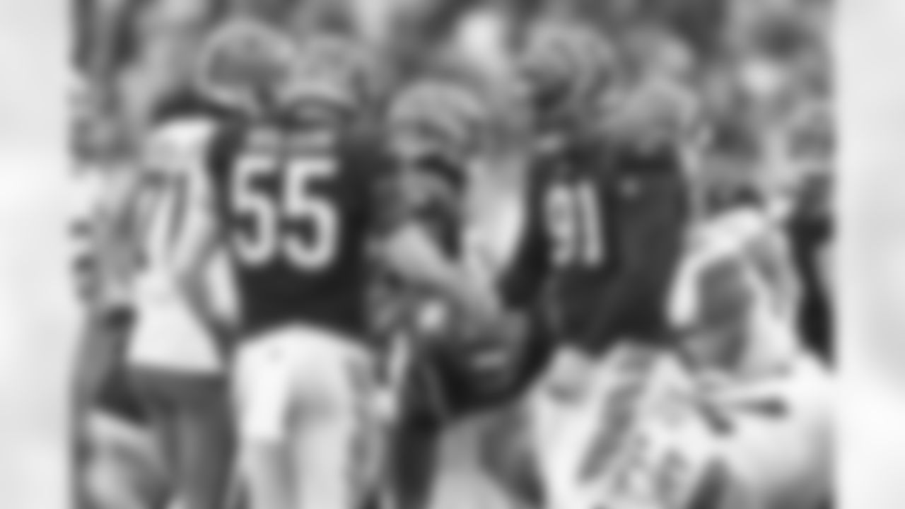 DE Trey Hendrickson (right) celebrates with LB Logan Wilson during the third quarter of the Browns-Bengals game in Week 14 at Paycor Stadium in Cincinnati, Ohio.