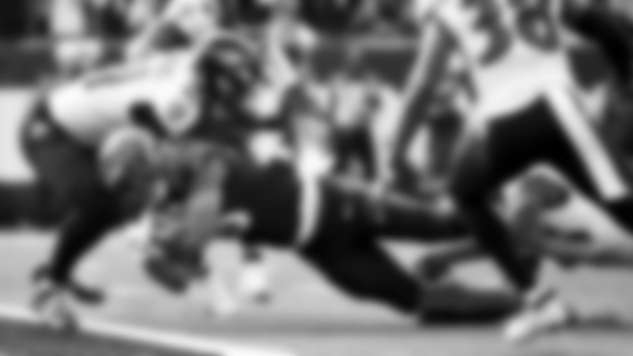 Cincinnati Bengals running back Joe Mixon (28) dives into the end zone for a touchdown against the Baltimore Ravens in the first half during an NFL football game, Sunday, Dec. 26, 2021, in Cincinnati. (AP Photo/Emilee Chinn)