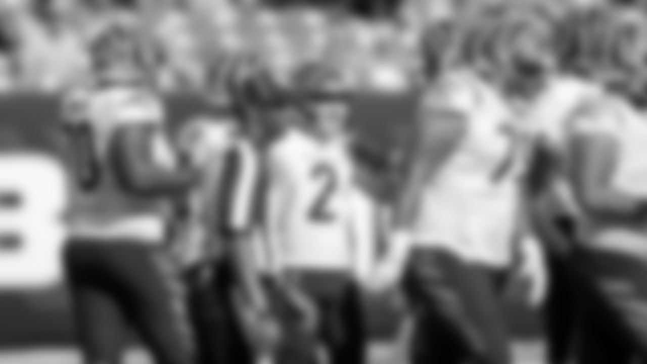Kicker Evan McPherson celebrates with his teammates after converting a 57-yard field goal.