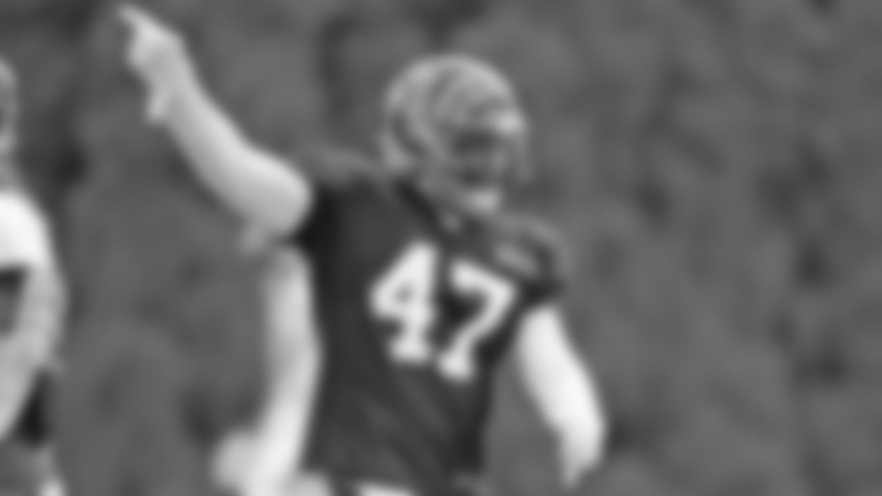 Linebacker Austin Calitro points after making a play during training camp practice.