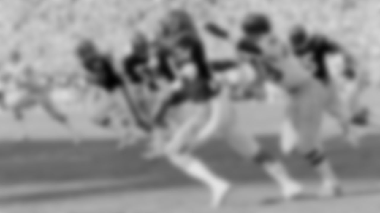 Cincinnati Bengal cornerback Louis Breeden shakes the hold of San Diego Chargers' Charlie Joiner after intercepting a pass in this end zone at San Diego, Nov. 8, 1981. Breeden returned the pass interception 102 yards for a Cincinnati touchdown that gave the Bengals a 31-7 lead with 49 seconds left in the half. (AP Photo/Lenny Ignelzi)