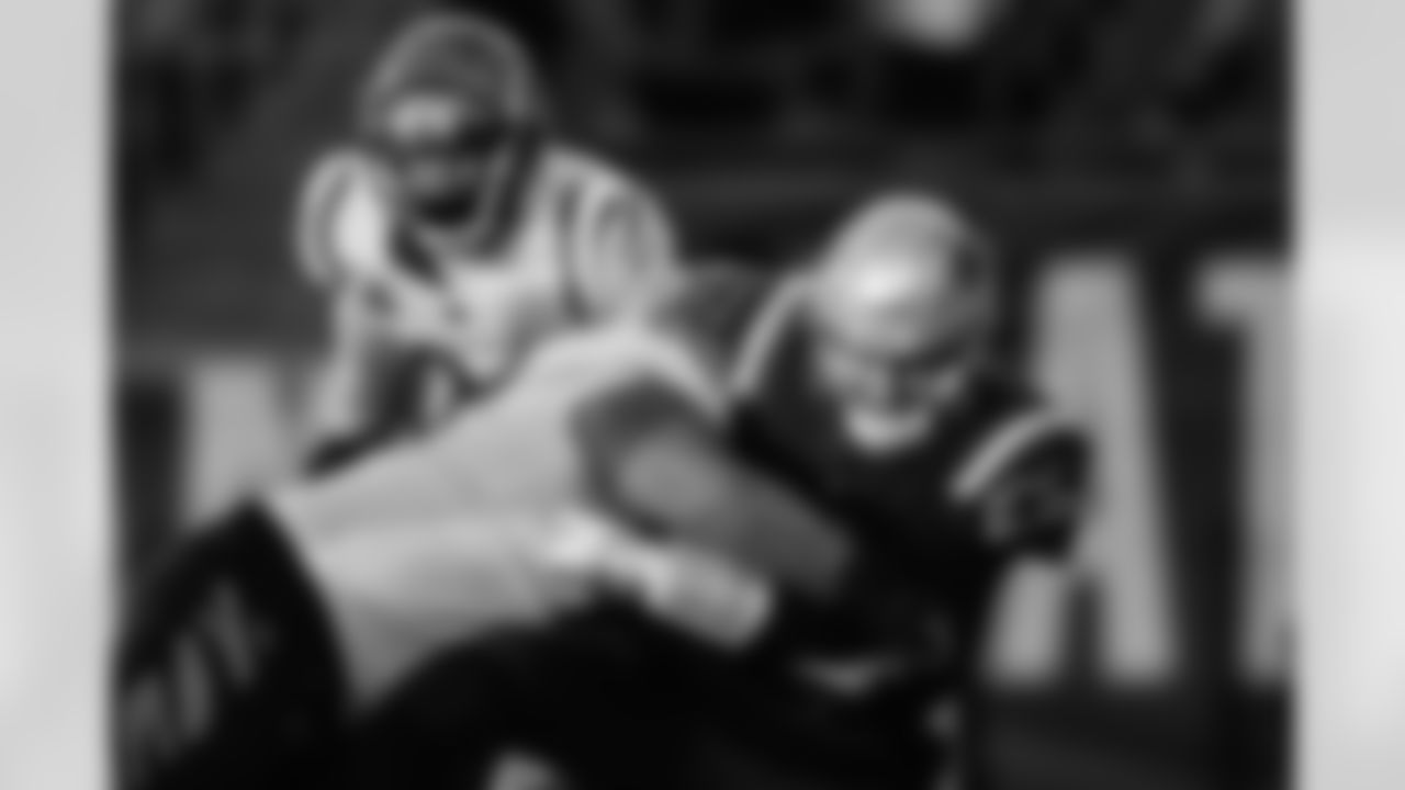 DT Josh Tupou sacks the Patriots ballcarrier in the third quarter of the Bengals-Patriots game on Saturday, December 24 2022 at Gillette Stadium in Foxborough, Massachusetts.