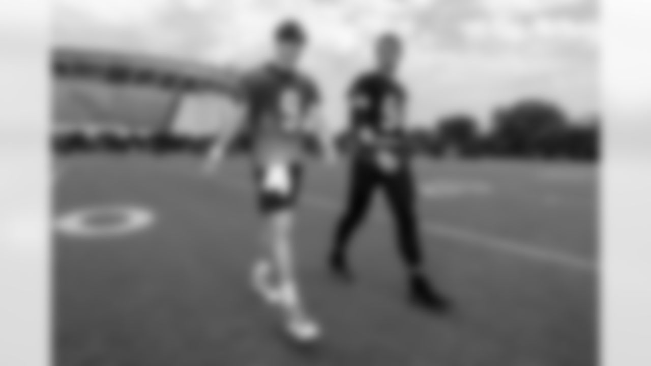 QB Joe Burrow (left) and DE Sam Hubbard walk off the field after the first day of Bengals Training Camp 2023 at Kettering Health Practice Fields on Wednesday, July 26 2023 in Cincinnati, Ohio.