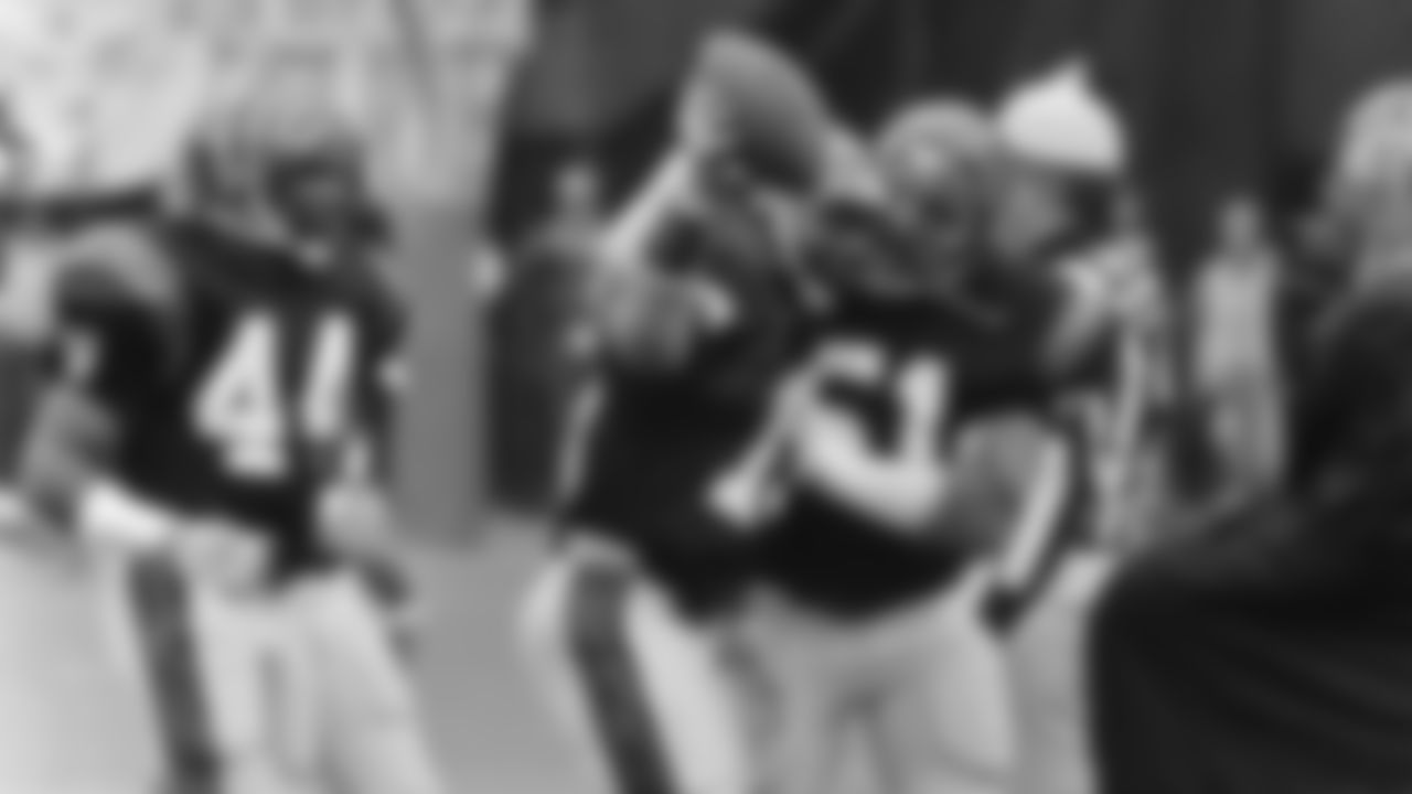 1982: Ken Riley holds up the ball after recording an interception in the AFC Playoffs.
