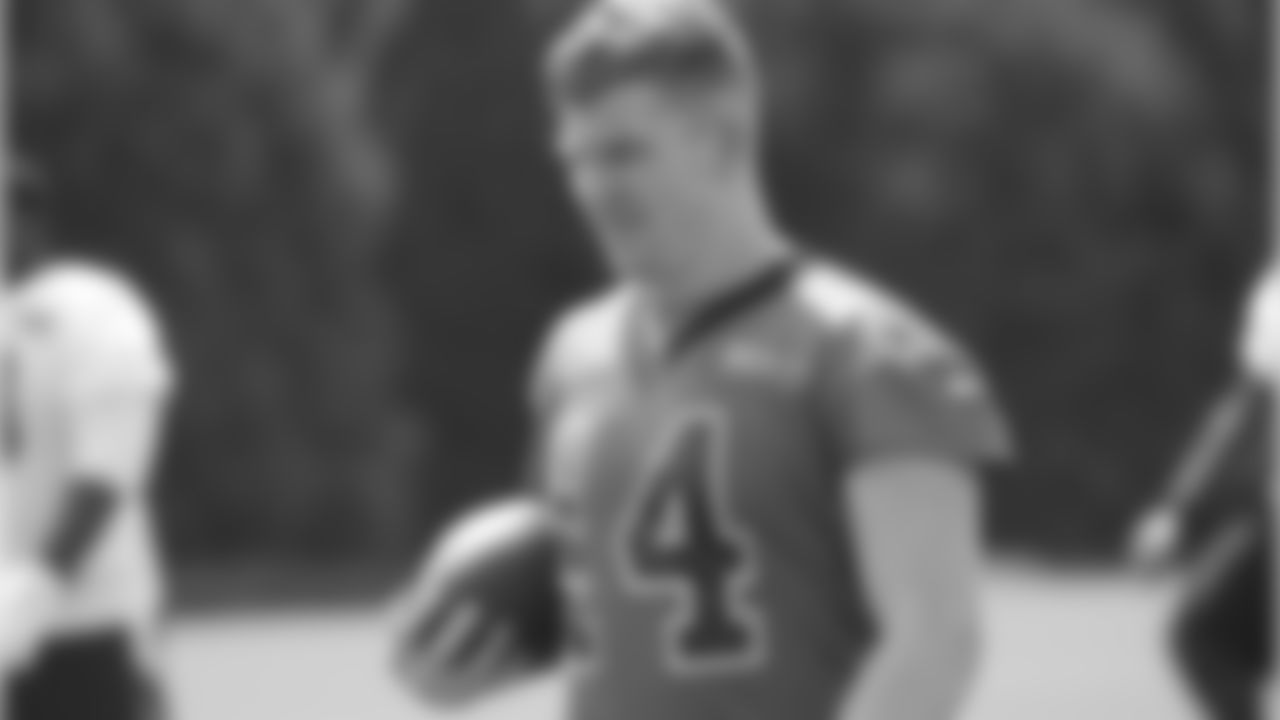 QB Andy Dalton warming up prior to practice.