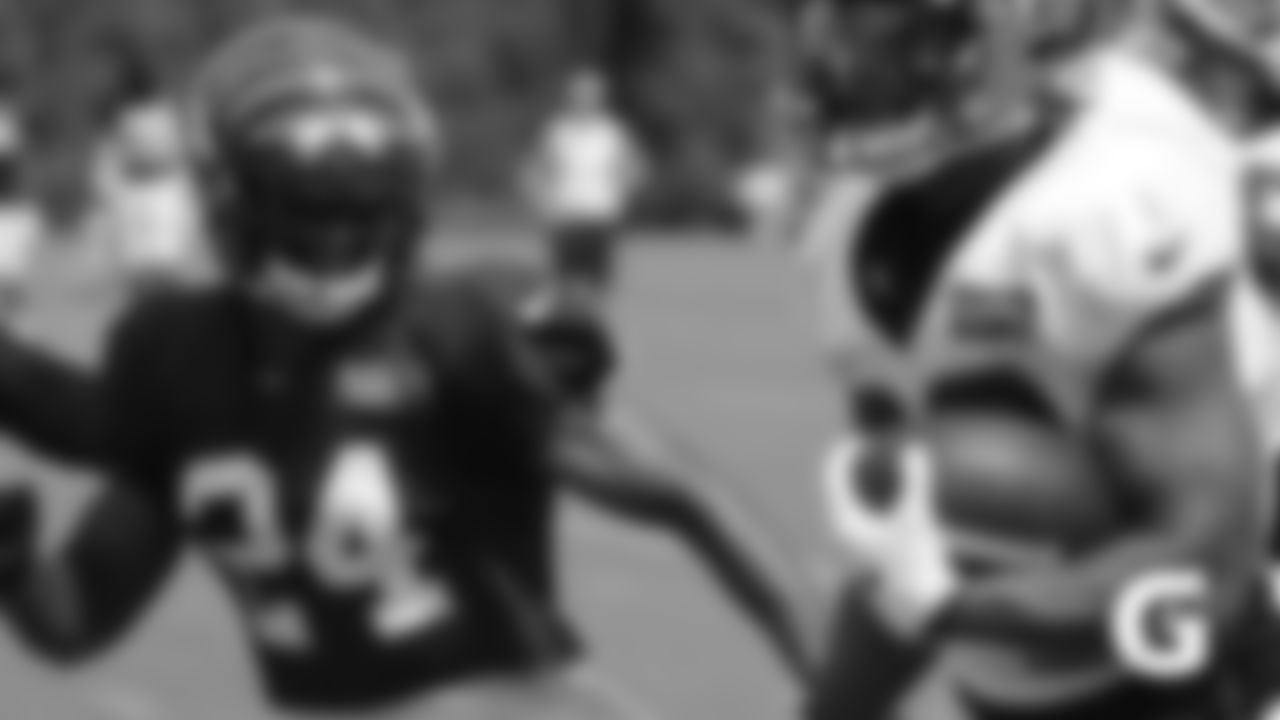Cornerback B.W. Webb chases down RB Joe Mixon during a 7-on-7 drill at training camp.