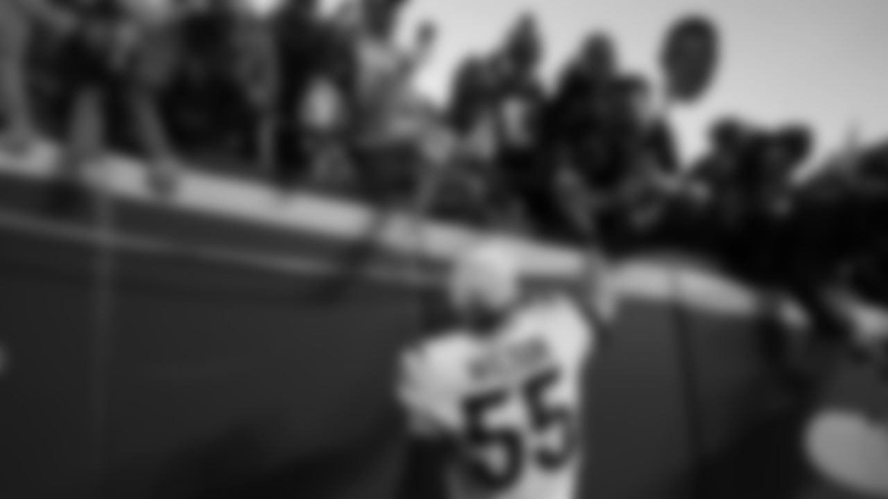 Cincinnati Bengals linebacker Logan Wilson celebrates with fans after the AFC championship NFL football game against the Kansas City Chiefs, Sunday, Jan. 30, 2022, in Kansas City, Mo. The Bengals won 27-24 in overtime. (AP Photo/Ed Zurga)