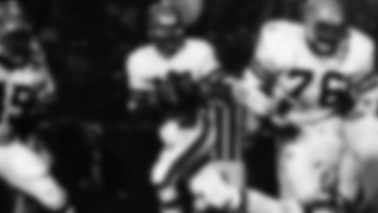 Cincinnati Bengals quarterback Ken Anderson (14) drops back to pass behind tackle Vernon Holland (76) during an NFL game against the Los Angeles Rams in Los Angeles on Dec. 11, 1978. The Bengals defeated the Rams 20-19 on Monday Night Football. (AP Photo/NFL Photos)