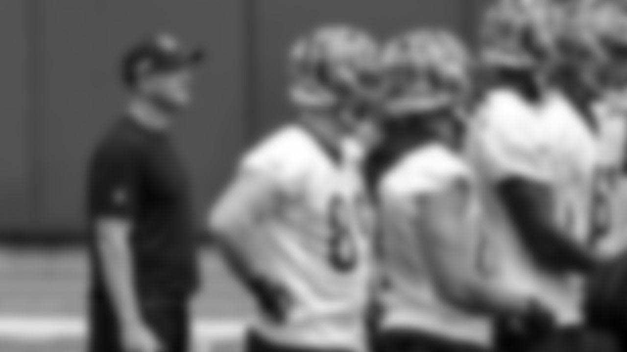 Cincinnati Bengals' head coach Zac Taylor stands with his team during an NFL football minicamp practice in Cincinnati.