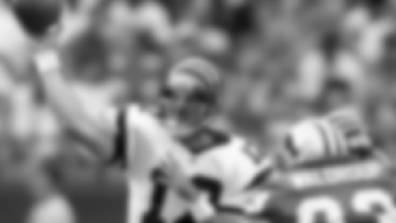 Cincinnati Bengals quarterback Neil O'Donnell passes under pressure from Detroit Lions' Kerwin Waldroup (93) in the first half Sunday, Sept. 13, 1998, in Pontaic, Mich. O'Donnell completed 25-of-36 for 303 yards and two touchdowns in the Bengals 34-28 win. (AP Photo/Duane Burleson)
