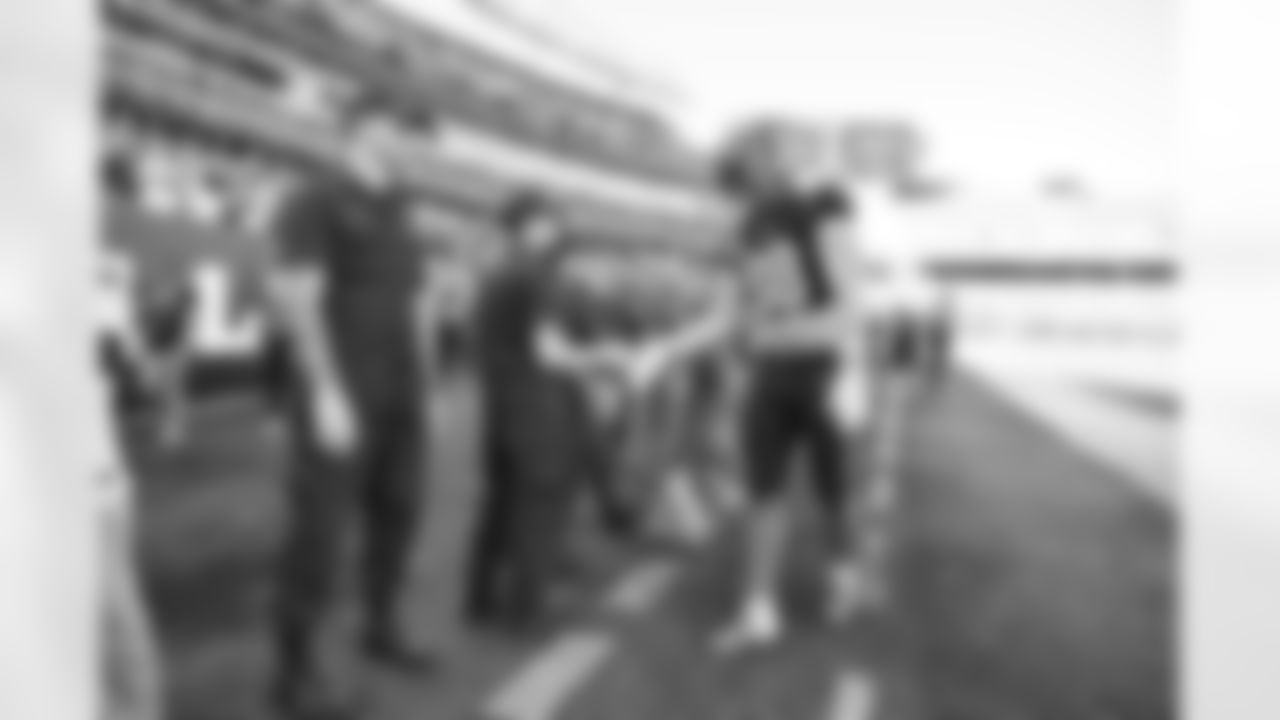 TE Hayden Hurst shakes hands with members of the United States military before kickoff of the Bengals-Panthers game in Week 9 of the 2022 season at Paycor Stadium in Cincinnati, Ohio.