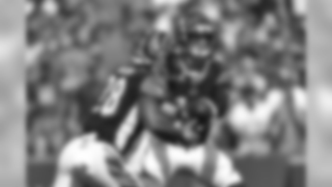 Cincinnati Bengals quarterback Andy Dalton (14) hands off to Cincinnati Bengals' Joe Mixon (28) during the first half of an NFL football game Sunday, Aug. 26, 2018, in Orchard Park, N.Y. (AP Photo/Adrian Kraus)