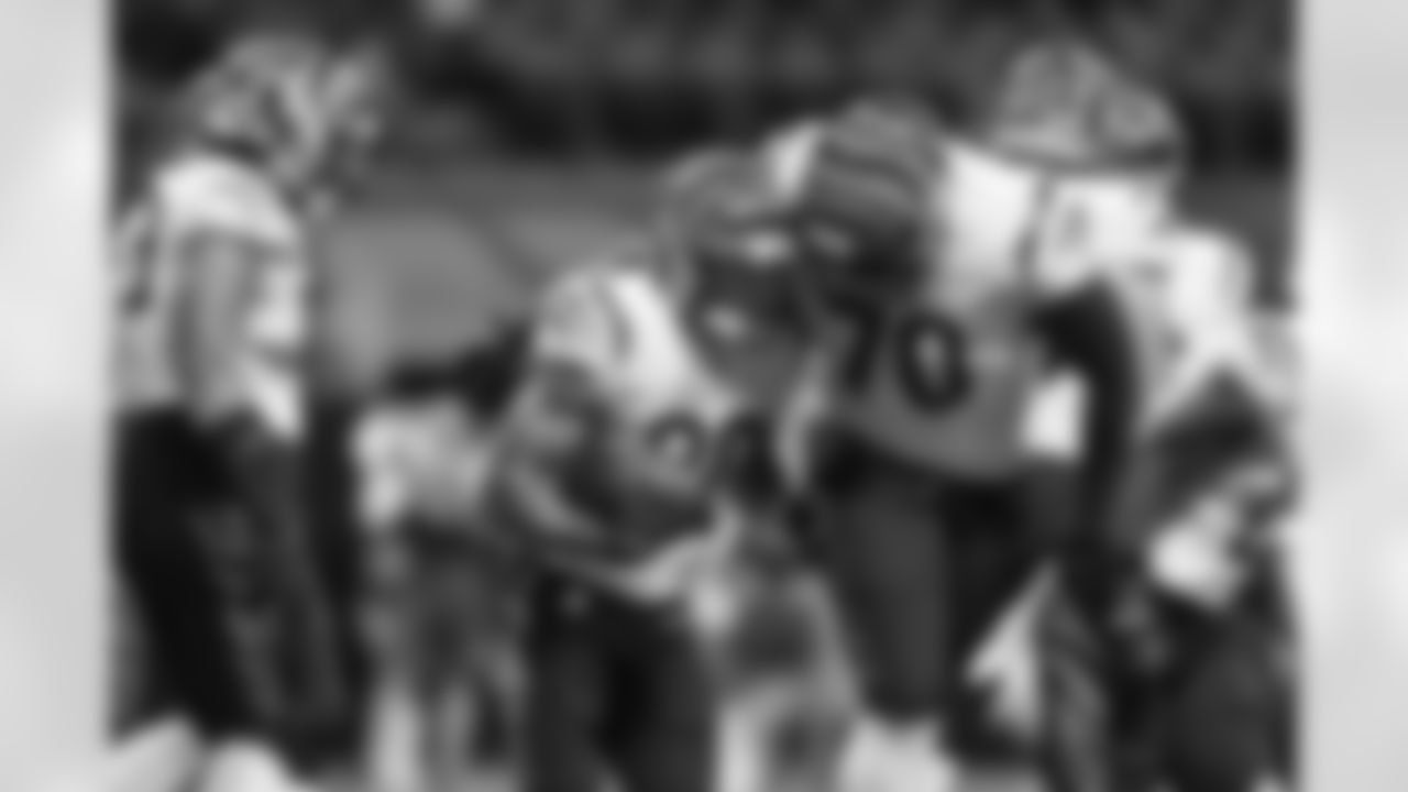 HB Chase Brown (left) celebrates a touchdown with OT D'Ante Smith during the Bengals-Falcons game in week 2 of the 2023 preseason.