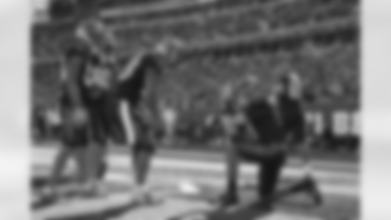 QB Joe Burrow takes a photo of HB Joe Mixon after Mixon breaks 5,000 yards with a touchdown during the Bengals-Panthers Week 9 game on Sunday, November 6 2022.