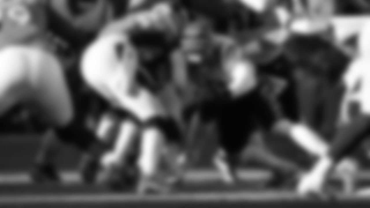 Linebacker Joe Bachie makes a tackle on Denver Broncos running back Melvin Gordon III.