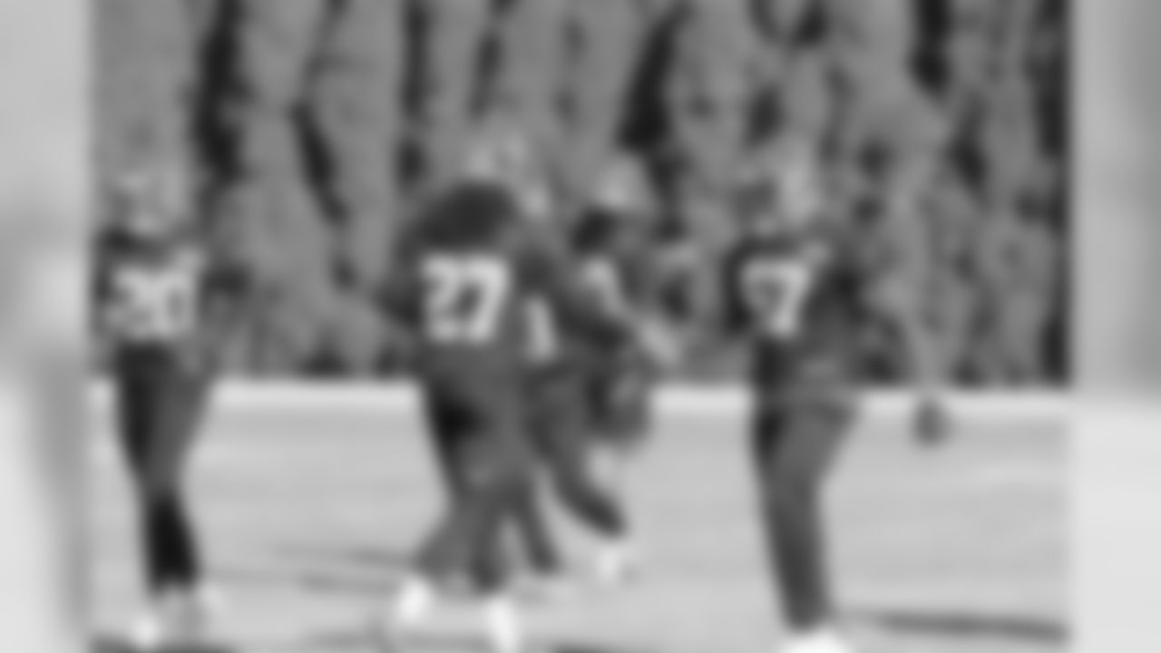 Dre Kirkpatrick greets Vontaze Burfict on the practice field in preparation for the week 16 game against the Browns.