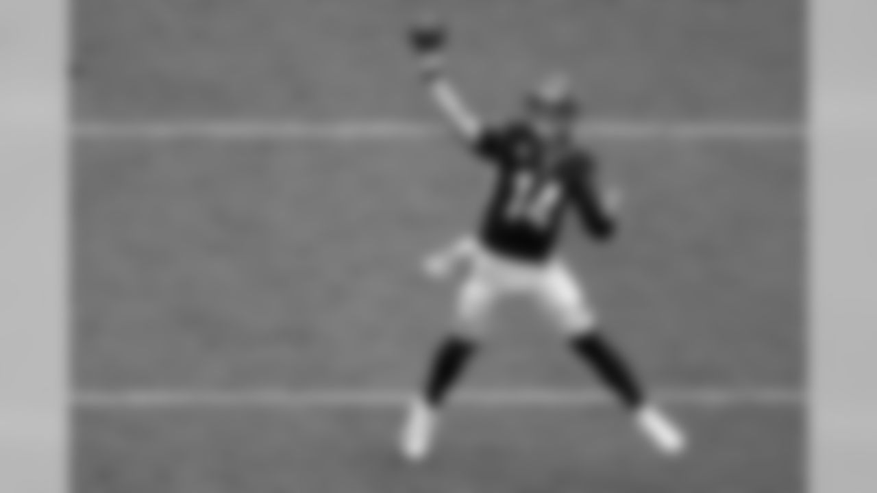 Cincinnati Bengals quarterback Andy Dalton (14) gets free away from the pocket and fires a pass against the Carolina Panthers during the second half of an NFL football game in Charlotte, N.C., Sunday, Sept. 23, 2018. (AP Photo/Bob Leverone)