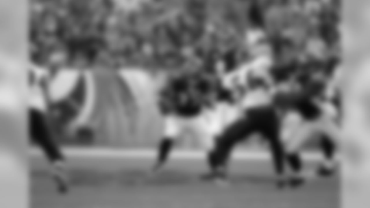 Cedric Benson finds a hole to rush through in a 2009 game against Baltimore.