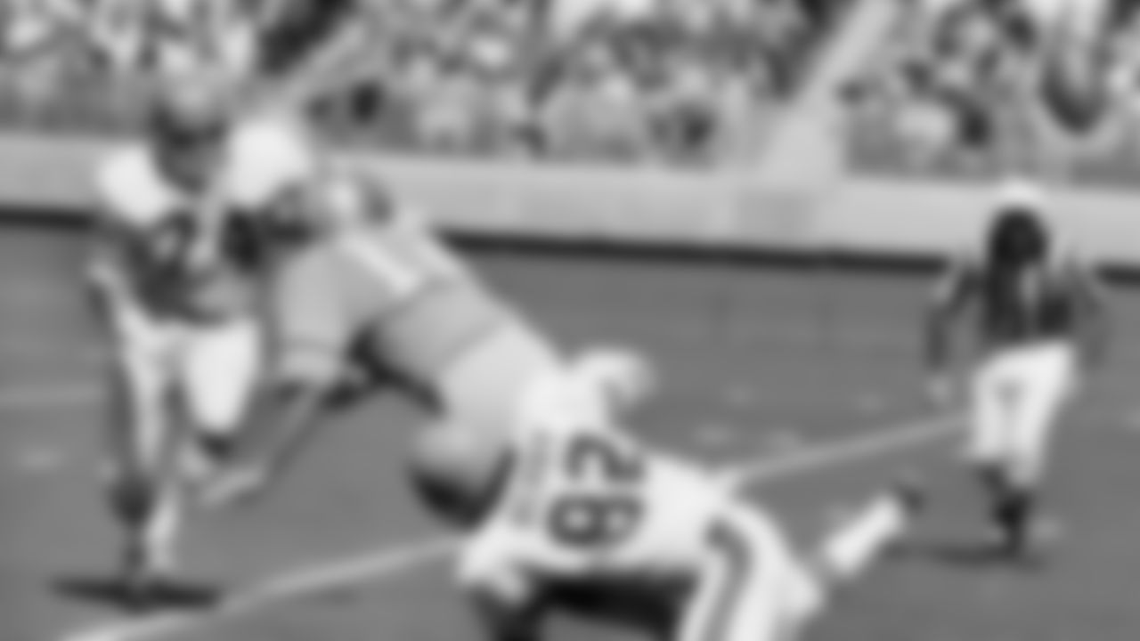 Houston Oilers Charley Johnson (12) was crunched by Cincinnati Bengals Royce Berry while trying to get away a short pass from his own six-yard-line in second quarter of a NFL game on Sunday, Oct. 4, 1970.
