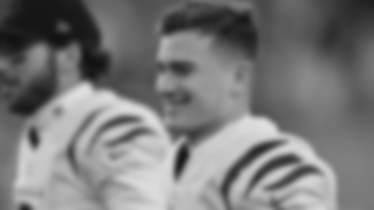 Evan McPherson smiles as he walks off the field at halftime against the Denver Broncos.
