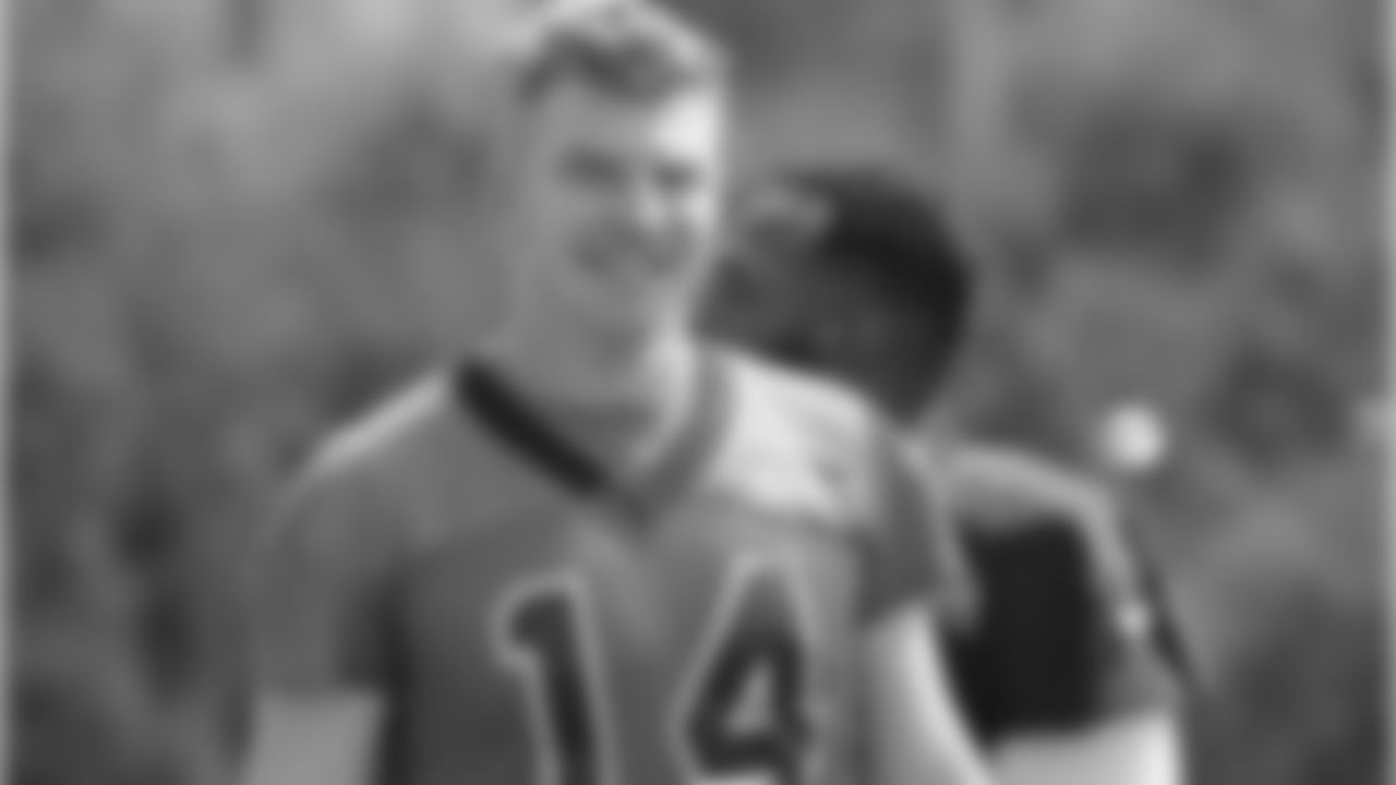 QB Andy Dalton walking to practice
