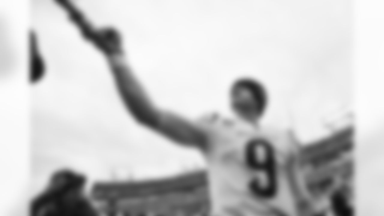 QB Joe Burrow fist bumps a fan after the Bengals-Titans game on Sunday, November 27 in Week 12 of the 2022 season.