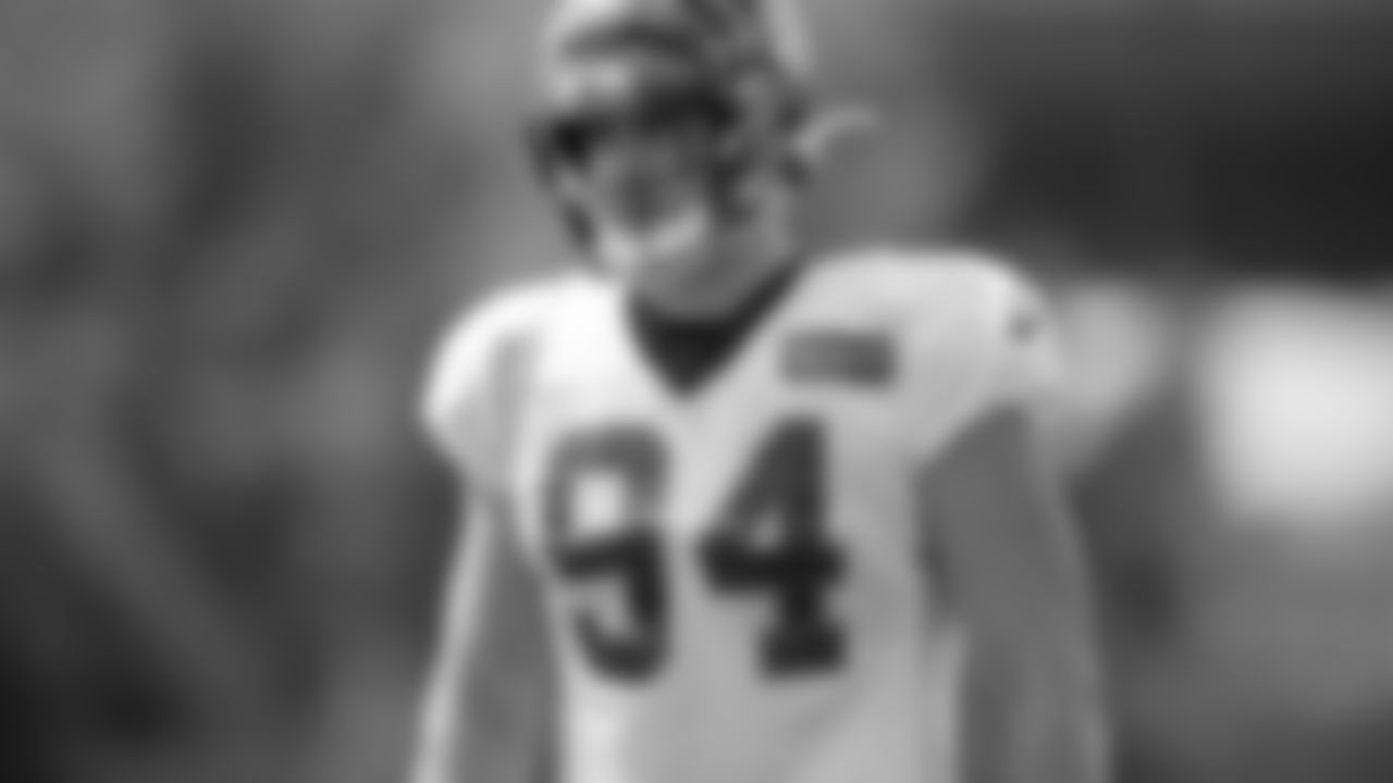 DE Sam Hubbard looks on at practice.