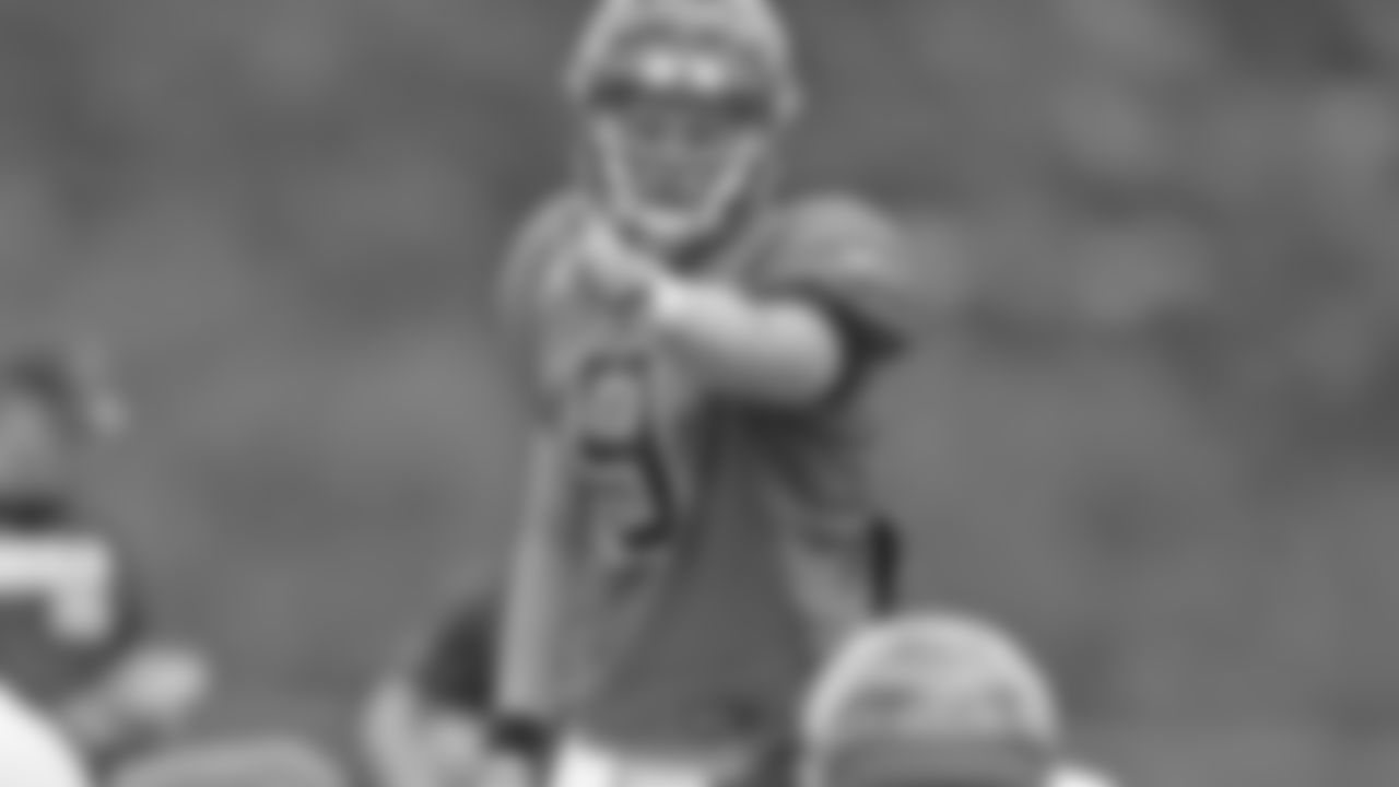 Quarterback Joe Burrow (9) points to the side during training camp practice on Friday, August 28, 2020.
