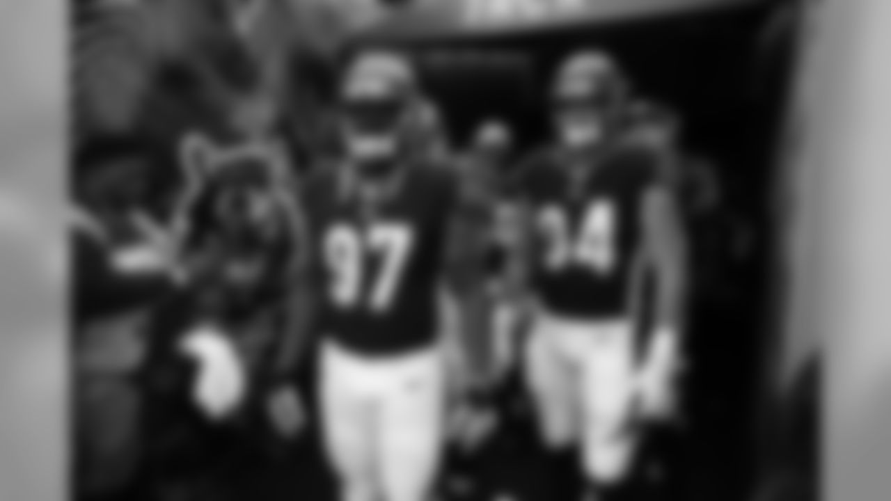 Cincinnati Bengals defensive tackle Geno Atkins (97) and defensive end Sam Hubbard (94) wait to take the field before an NFL football game against the Tampa Bay Buccaneers in Cincinnati, Sunday, Oct. 28, 2018. (AP Photo/Gary Landers)