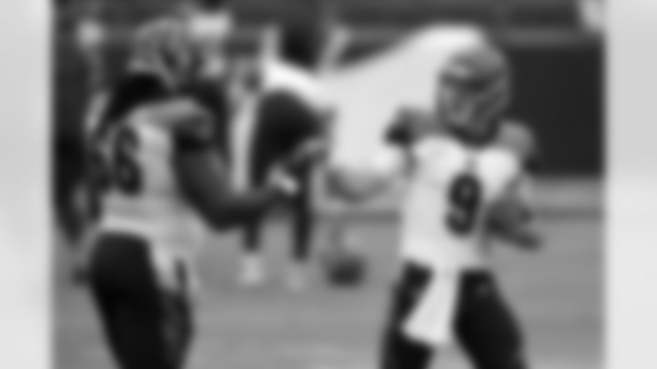 Cincinnati Bengals quarterback Joe Burrow (9) gives a fist bump to center Trey Hopkins (66) prior to an NFL football game, Sunday, Oct. 11, 2020, in Baltimore. (AP Photo/Gail Burton)