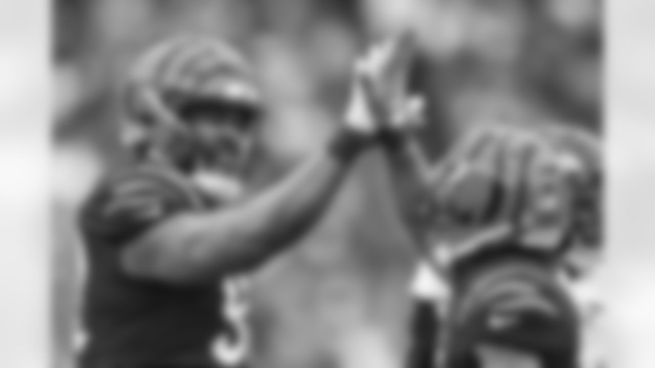 DT BJ Hill (left) and CB Mike Hilton celebrate during the fourth quarter of Week 18 against the Baltimore Ravens at Paycor Stadium in Cincinnati, Ohio on Sunday, January 8 2023.