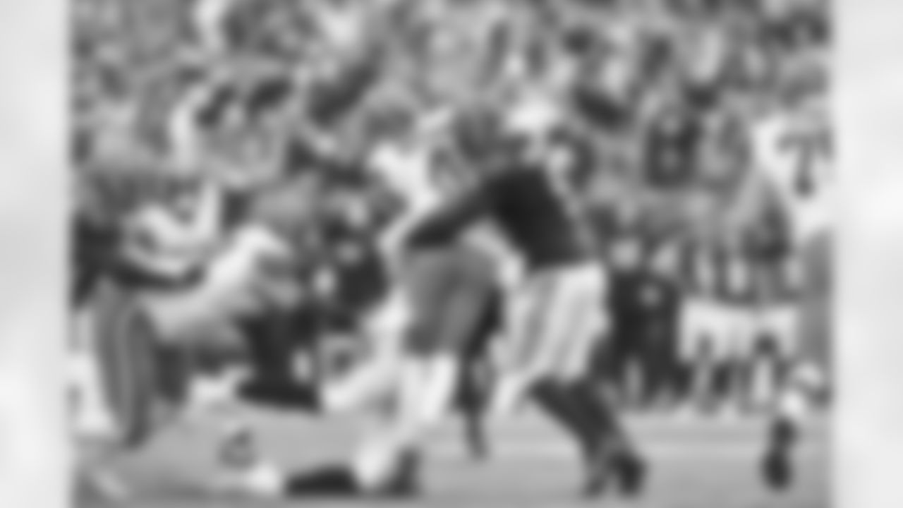 DE Trey Hedrickson tackles Browns QB Deshaun Watson during the first quarter of the Browns-Bengals game in Week 14 at Paycor Stadium in Cincinnati, Ohio.