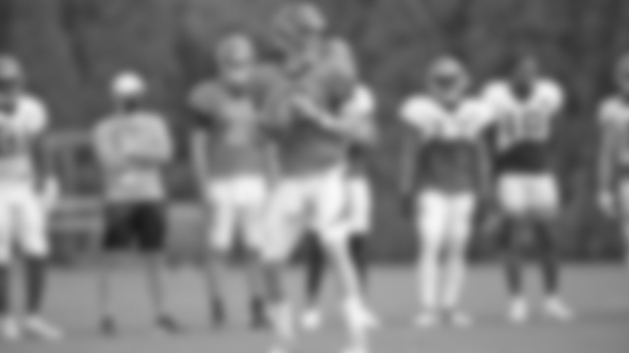 Quarterback Joe Burrow looks to find an open receiver during a drill at training camp practice.