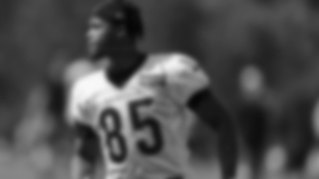 Bengals' Tee Higgins participates in a drill during an NFL football camp practice.