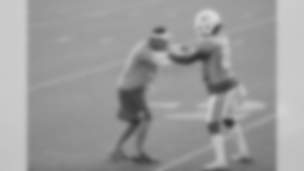Miami Dolphins defensive backs coach Lou Anarumo, left, runs through drills with cornerback Bobby McCain (28) at the teams NFL football training camp, Wednesday, Aug. 5, 2015 in Davie, Fla. (AP Photo/Wilfredo Lee)