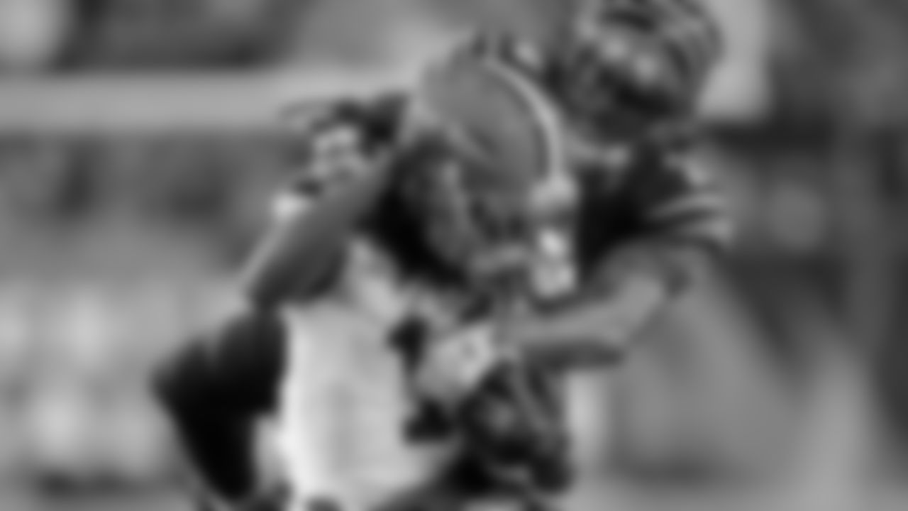Cleveland Browns wide receiver Travis Benjamin (11) is tackled by Cincinnati Bengals cornerback Adam Jones (24) during the first half of an NFL football game Thursday, Nov. 6, 2014, in Cincinnati. (AP Photo/AJ Mast)