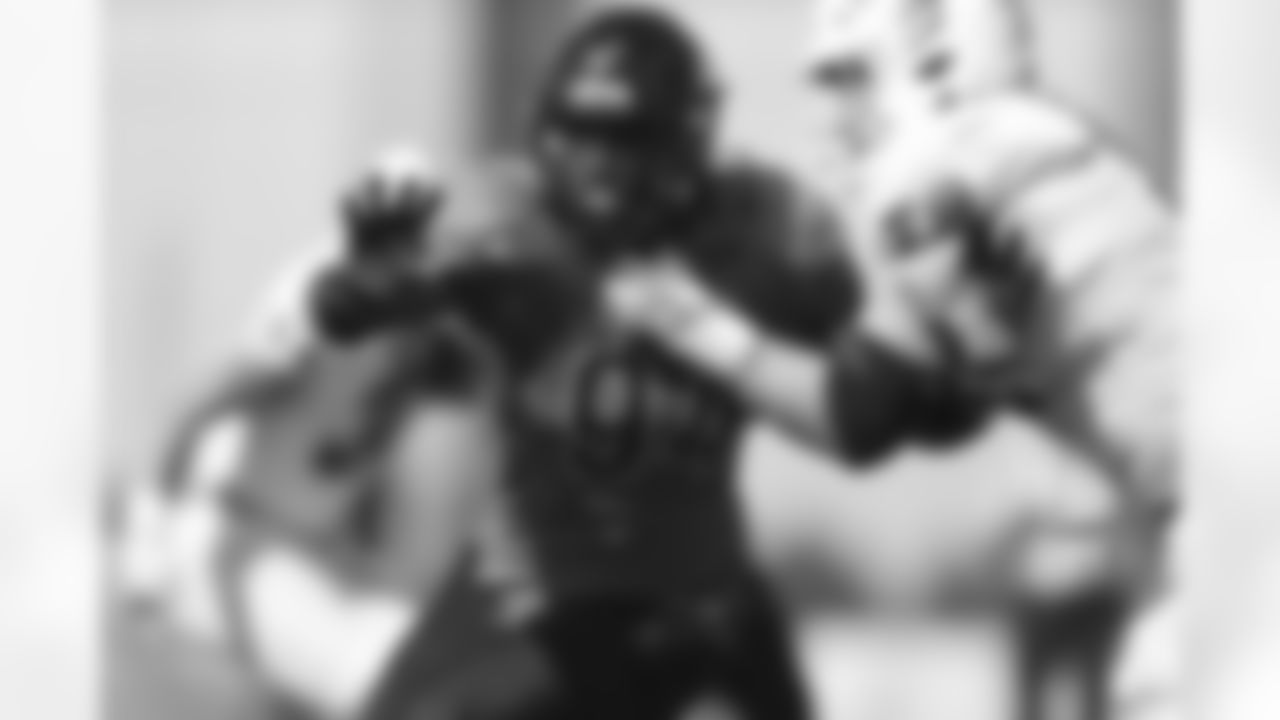 Coastal Carolina linebacker Jeffrey Gunter (94) runs through a block by Buffalo offensive lineman Jack Klenk (79) while rushing Buffalo quarterback Kyle Vantrease during the second half of a NCAA college football game in Buffalo, N.Y. on Saturday, Sept. 18, 2021. (AP Photo/Joshua Bessex)
