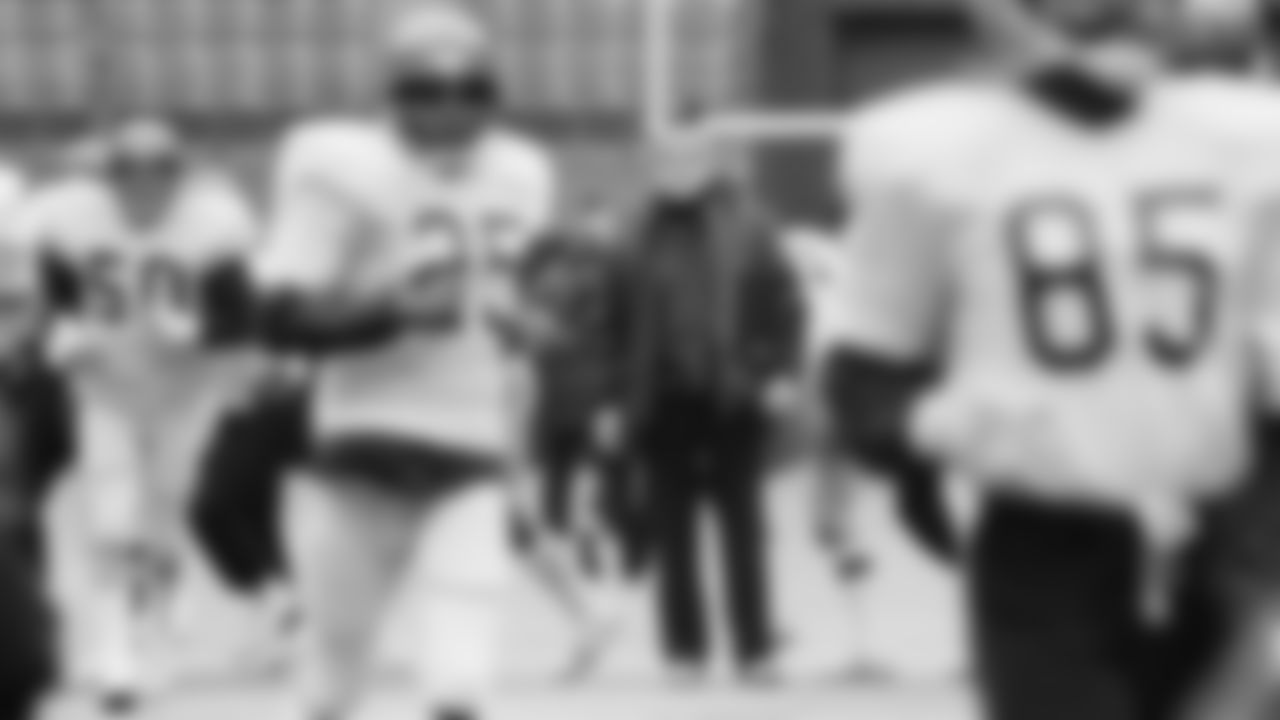 Cincinnati Bengals head coach Forrest Gregg stands in the middle of the field at Riverfront Stadium in Cincinnati and watches as his team runs laps during a practice session, Jan. 6, 1982. The Bengals are preparing for the AFC title game against the San Diego Chargers in Cincinnati. (AP Photo)