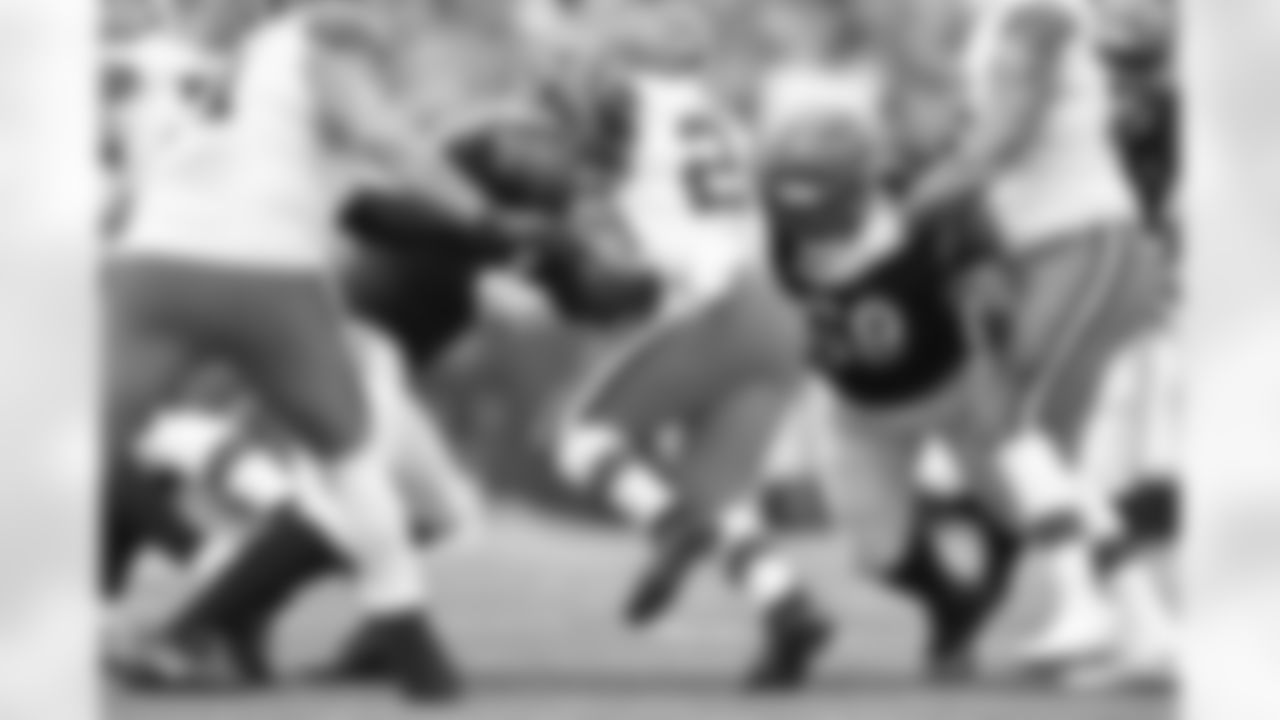 DE Trey Hendrickson (left) and DT Josh Tupou tackle Browns RB Nick Chubb during the first quarter of the Browns-Bengals game in Week 14 at Paycor Stadium in Cincinnati, Ohio.