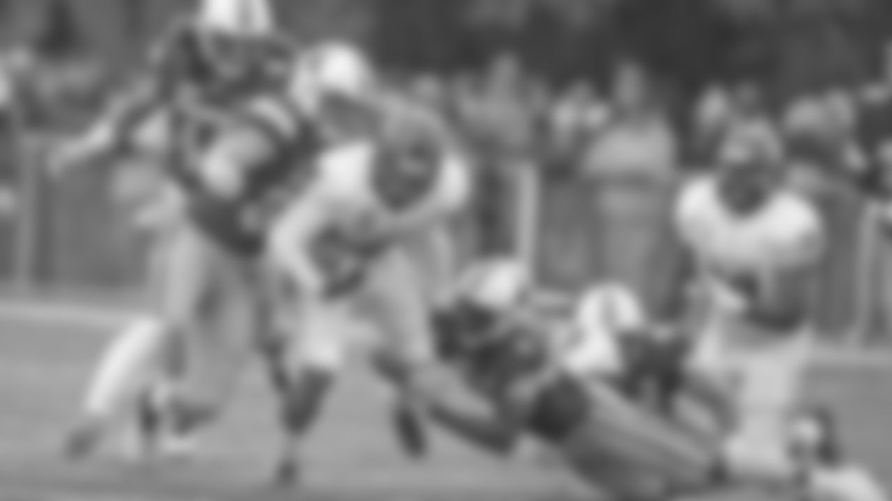 New Mexico running back Bryson Carrols is tackled by Wyoming defenders Logan Wilson, left, and Rome Weber during an NCAA college football game Saturday, Oct. 19, 2019, in Laramie, Wy. (AP Photo/Michael Smith)