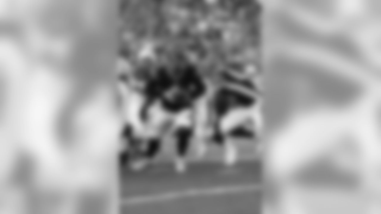 Quarterback Jeff Driskel hands the ball off during a preseason game against the Indianapolis Colts.