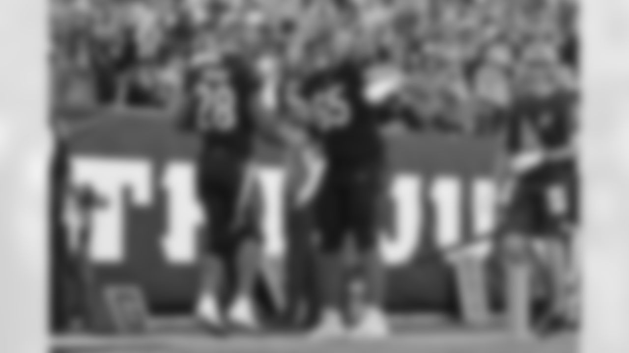 G Alex Cappa gives HB Joe Mixon a handshake after Mixon scores a touchdown during the Bengals-Panthers game in Week 9 of the 2022 season at Paycor Stadium in Cincinnati, Ohio.