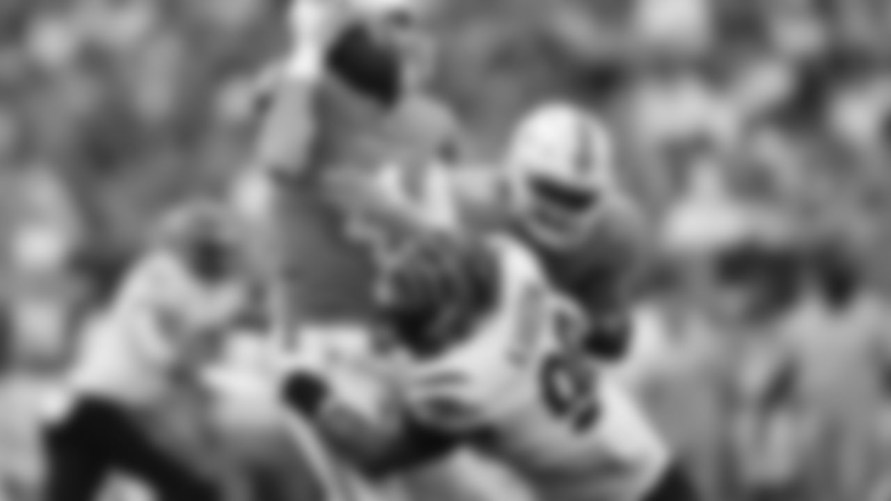 DE Khalid Kareem with a sack against Dolphins quarterback Reid Sinnett