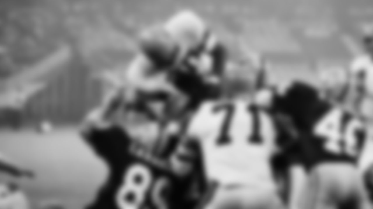 Cincinnati Bengals Jess Phillips leaped over a jam of players to score a touchdown in first quarter of an NFL game against the Washington Redskins in Cincinnati.