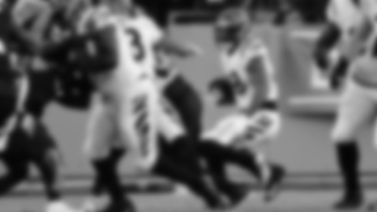 Running back Joe Mixon looks for a hole to rush through against the Tennessee Titans in the AFC Divisional Round.