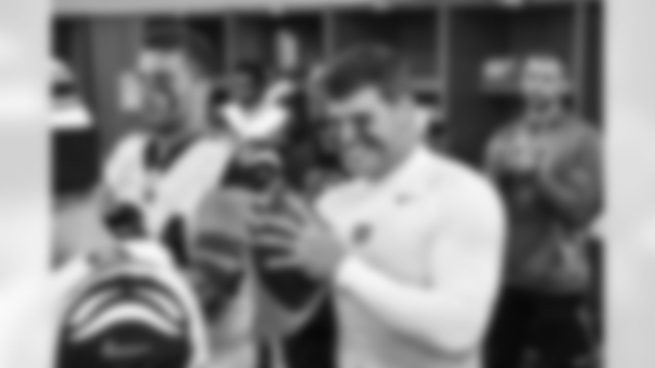 DE Trey Hendrickson reacts to getting his game ball after the Bengals beat the Steelers, 37-30, in Week 11 of the 2022 season.