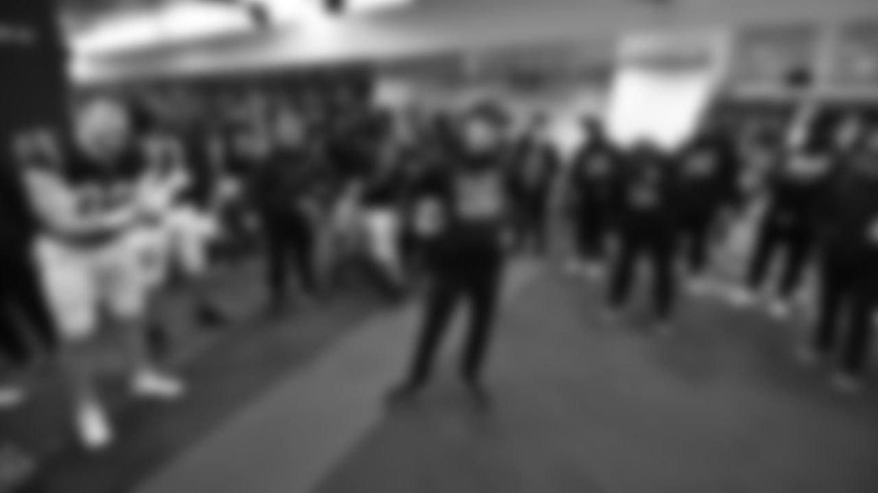 Inside the locker room as head coach Zac Taylor is cheered by his players following the Bengals 26-19 win over the Las Vegas Raiders in the AFC Wild Card.